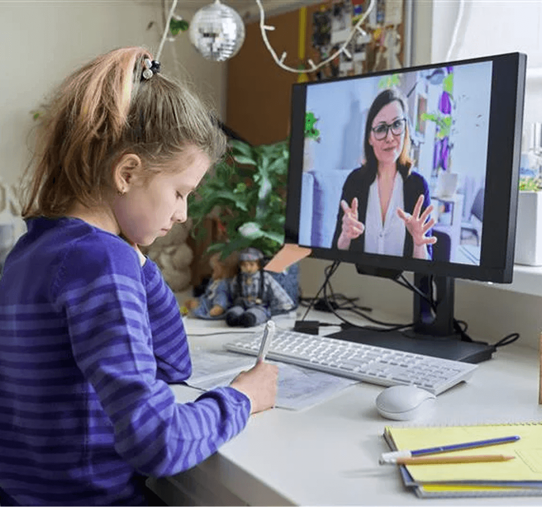 A young student meeting her tutor on a video call